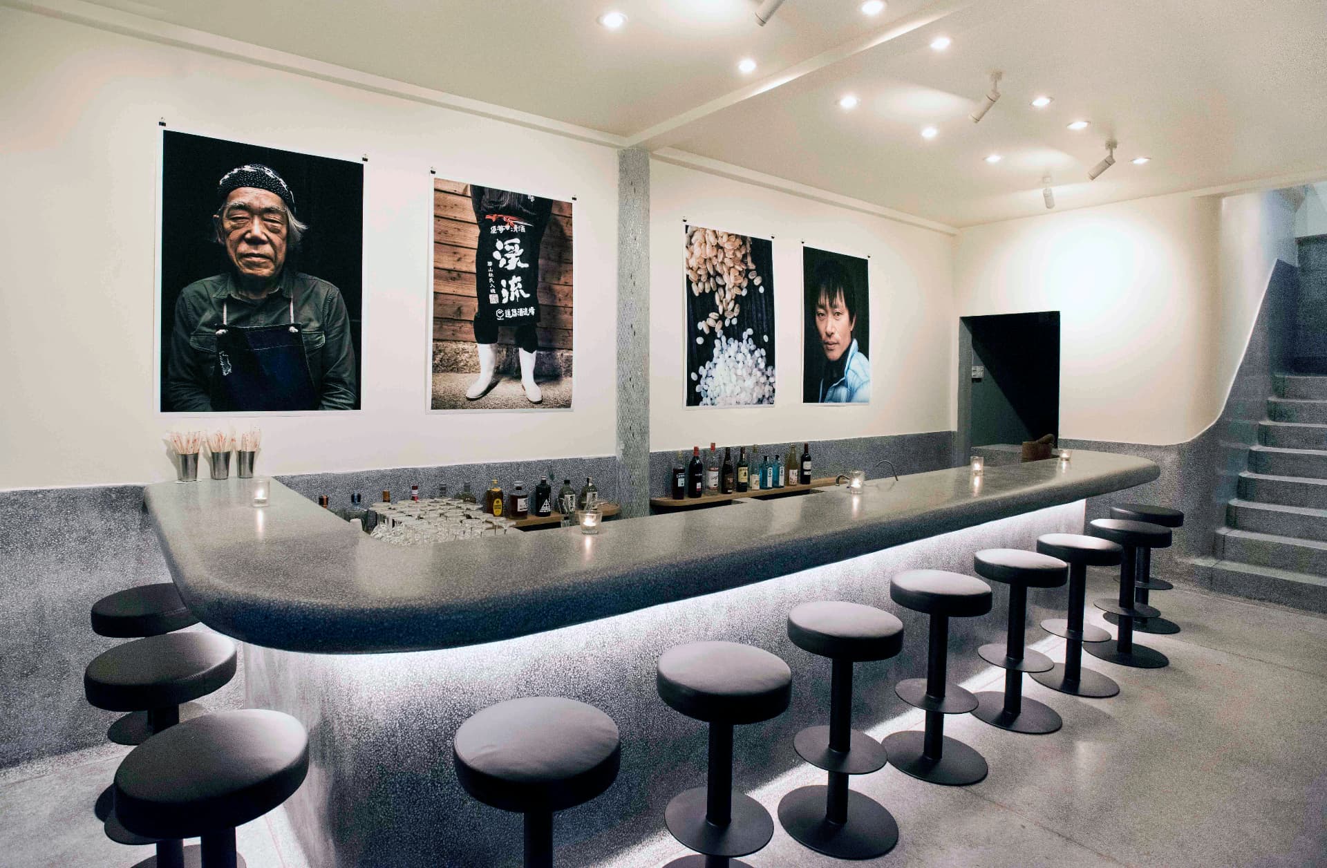 JUA counter bar interior with stools and artwork