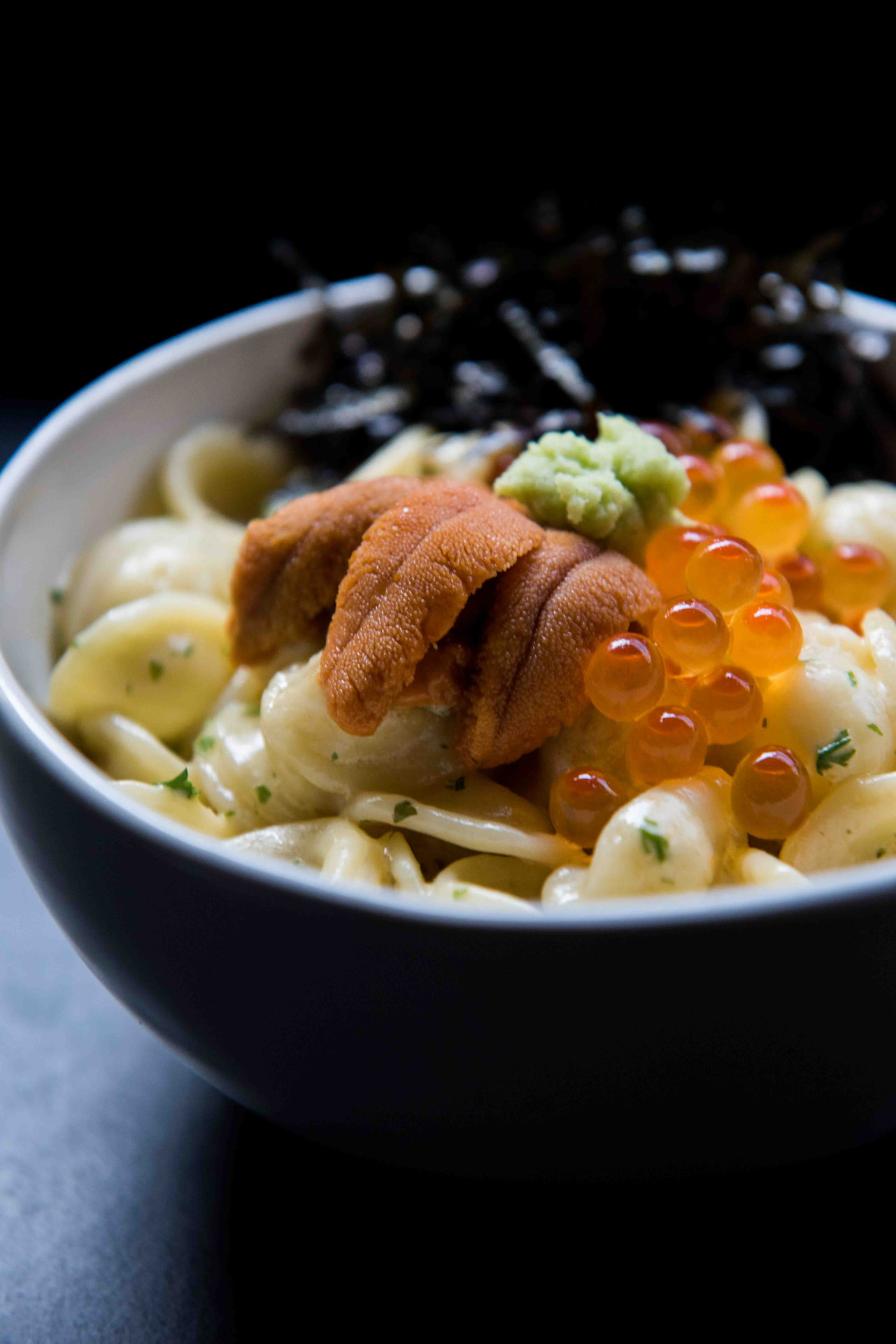 Creamy pasta topped with uni, ikura and wasabi