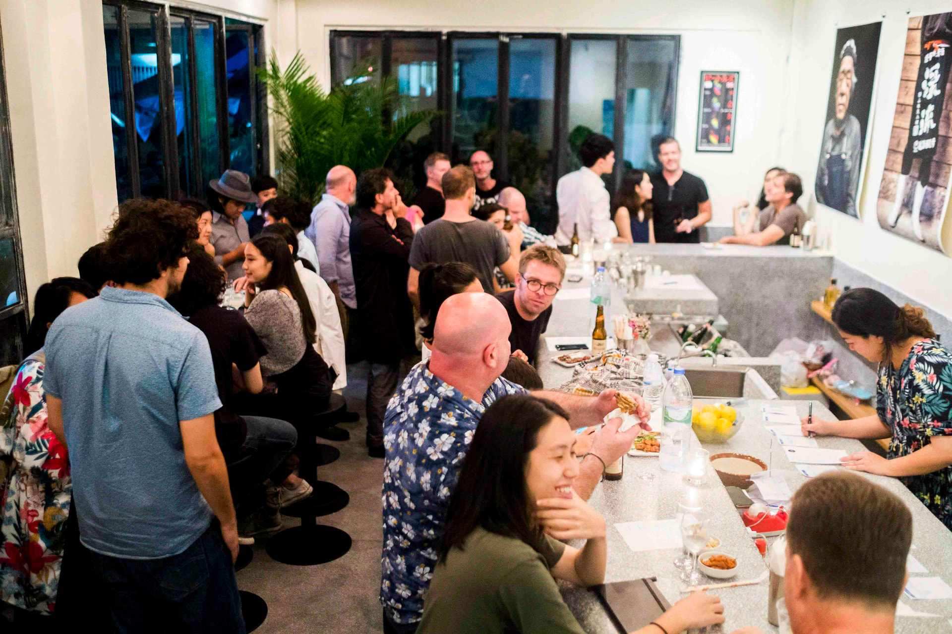 Guests gathered along the JUA counter bar