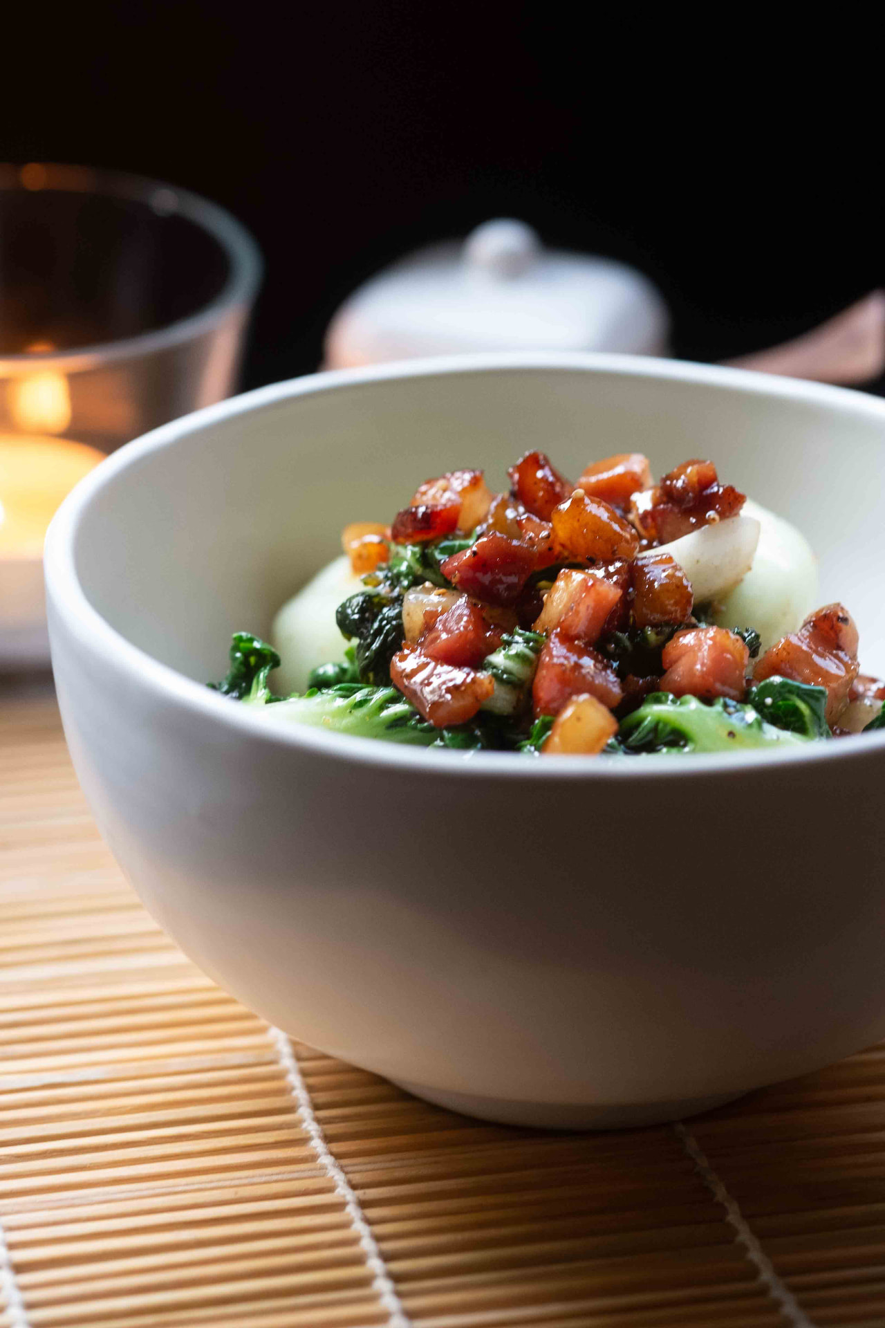 Bowl of bok choy with butter and crisp bacon